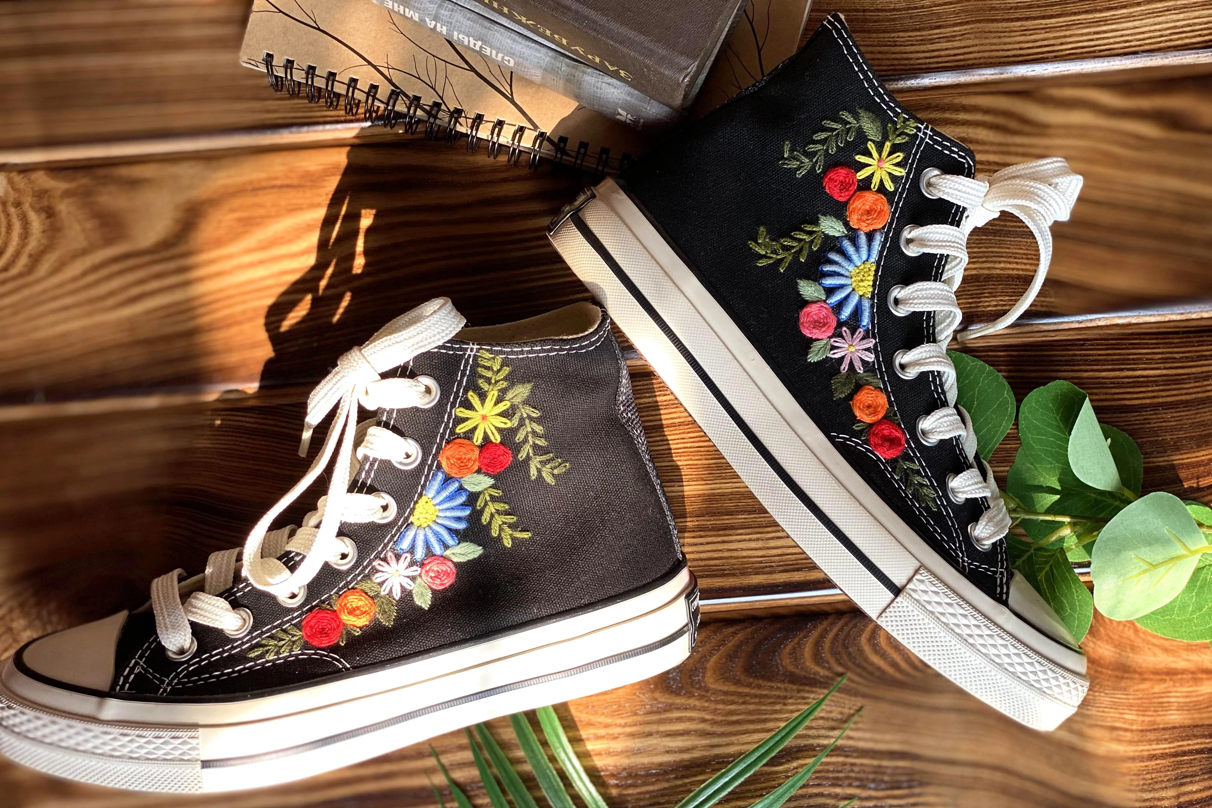 Converse High Tops shoes are embroidered with colorful flowers